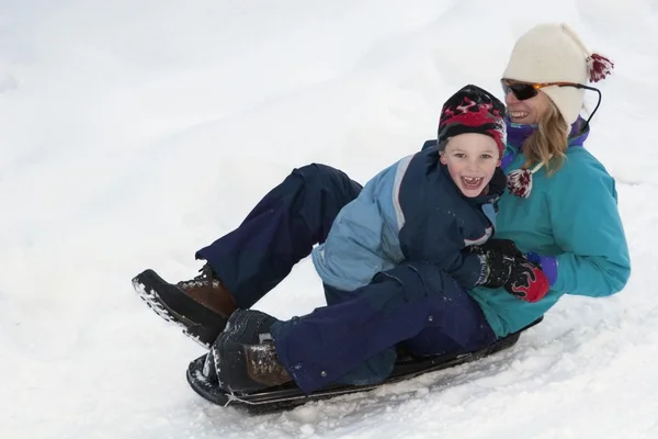 Mother And Son Sledding — Stock Photo, Image