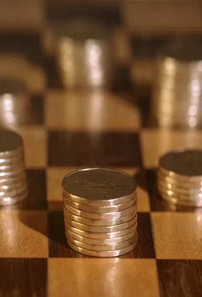 Piles Of Pennies On Checkerboard — Stock Photo, Image