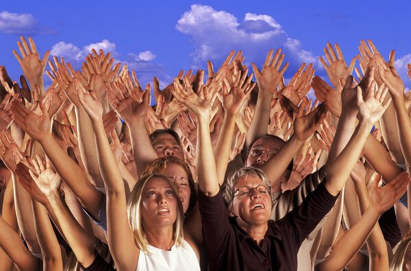 Many Hands Raised In Worship