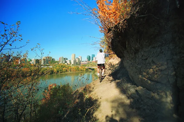 Man Cycling On Path Beside River — Stock Photo, Image