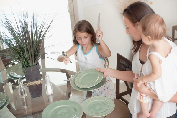 Mother And Daughter Setting The Table Together — Stock Photo, Image