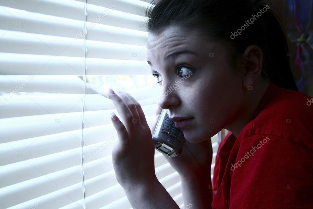 Teenage Girl On The Phone, Peeking Out A Window
