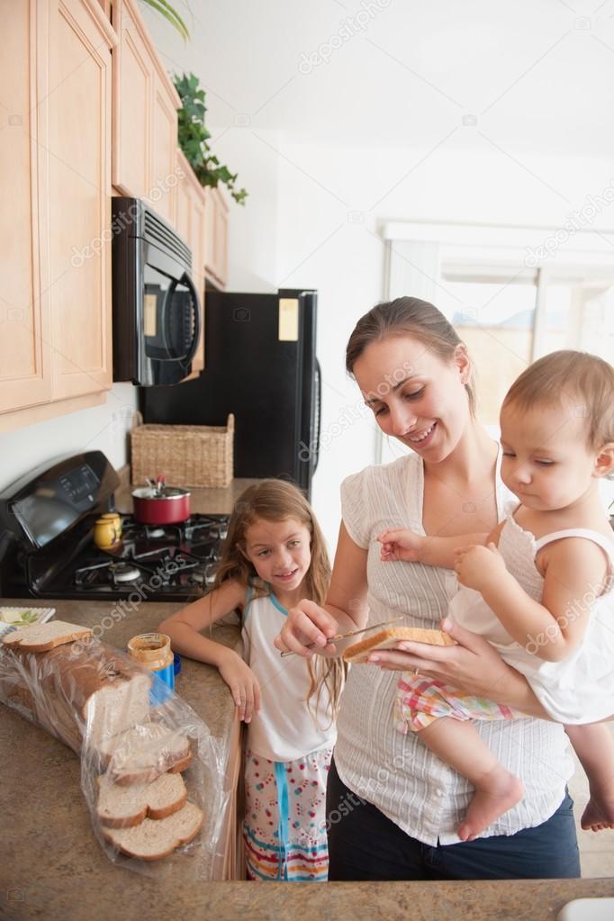 Mother Making A Sandwich For Her Girls