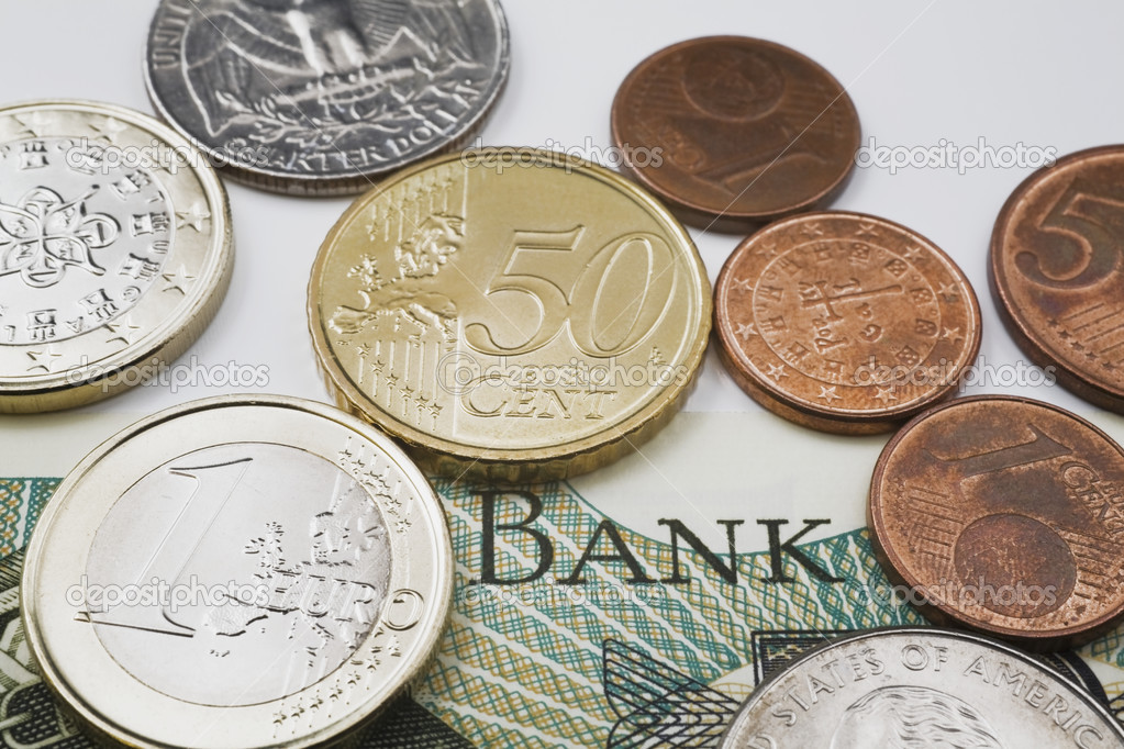 American And Euro Coins On Top Of A Foreign Currency Bank Note — Stock