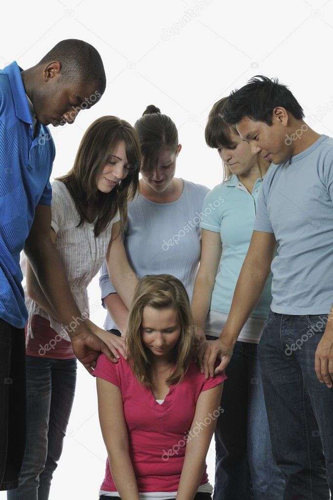 Diverse Group Of Young Adult Christians Praying