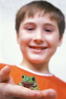 Portrait Of Boy With Frog clipart