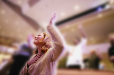 Woman Worshipping In Church