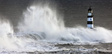 Waves Crashing On A Lighthouse, Seaham, Teesside, England clipart