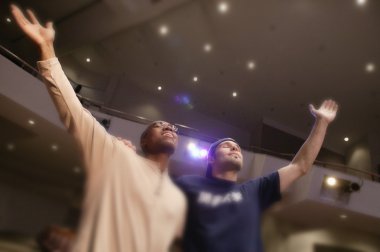 Two Men Worshipping God In Unity clipart