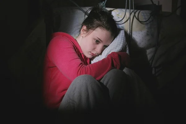 Scared Teenage Girl Sitting In Bedroom — Stock Photo, Image