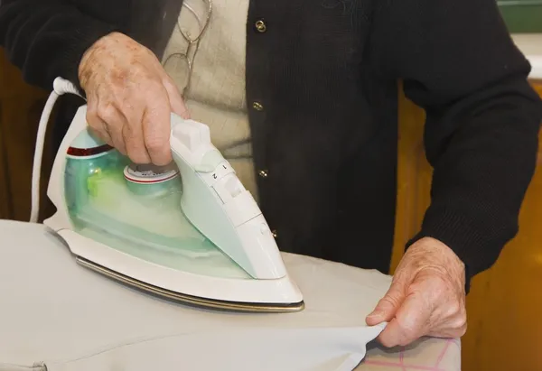 Older Woman Ironing — Stock Photo, Image