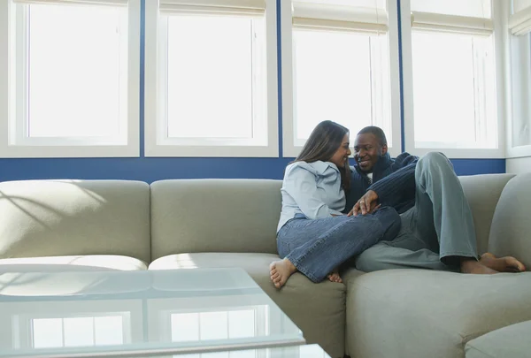 Couple Snuggles On Sofa — Stock Photo, Image