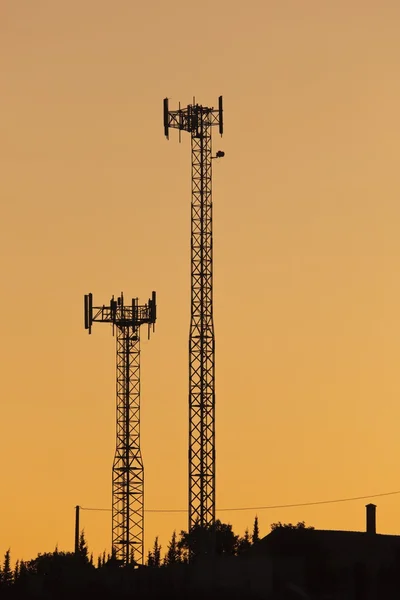 Silhouette Of Cell Phone Masts — Stock Photo, Image