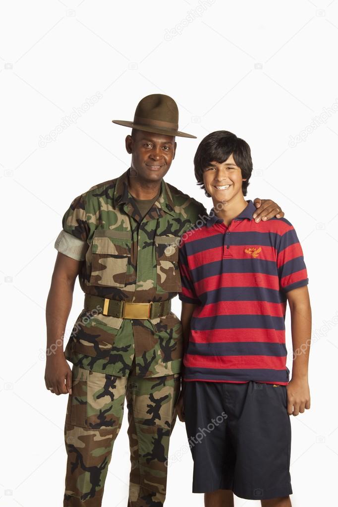 Military man embraced a teenage boy