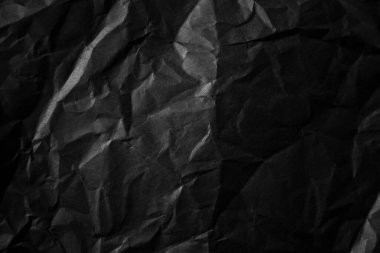 Buruşmuş siyah kağıt arkaplanı.