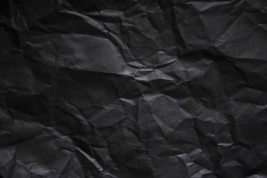 Buruşmuş siyah kağıt arkaplanı.