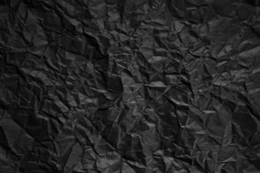Buruşmuş siyah kağıt arkaplanı.