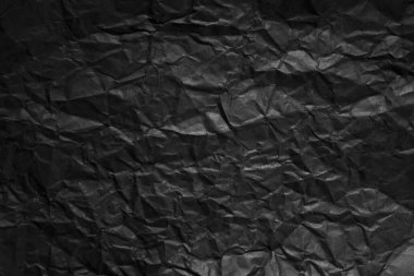 Buruşmuş siyah kağıt arkaplanı.