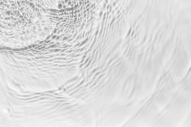 Waves on transparent water surface, gray abstract background.