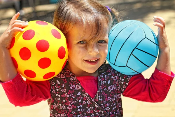 Girl with two balls — Stock Photo, Image