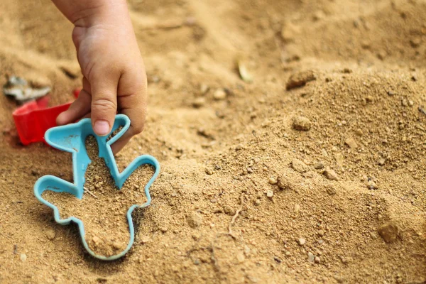 A boy playing in the sandbox — Stock Photo, Image