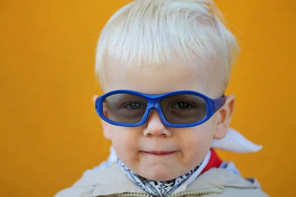 Boy wears 3D glasses and he smiles. Close-up