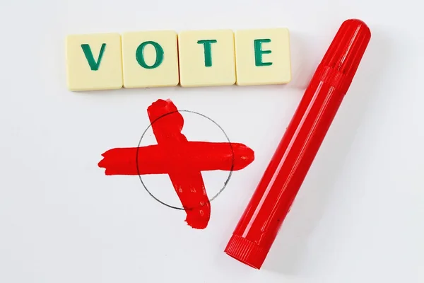 Vote with red pen — Stockfoto
