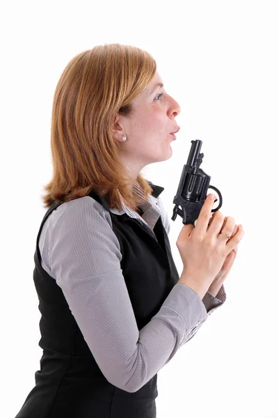 Profilbild einer Frau mit einer Schreckschusspistole lizenzfreie Stockfotos