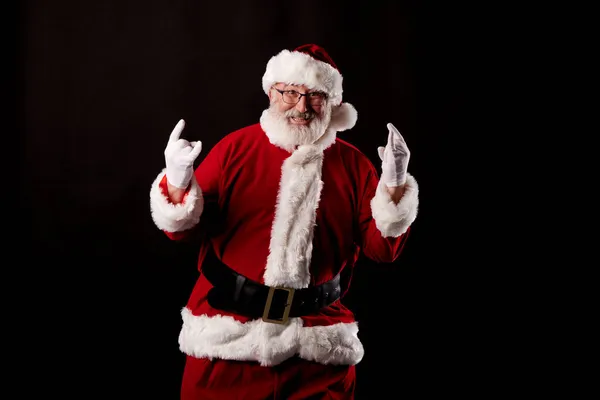 Santa Claus Het Maken Van Een Rocker Gebaar Zwarte Achtergrond — Stockfoto