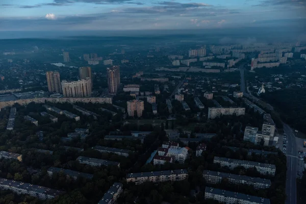 Blue morning cloudy view in summer city residential district. Aerial cityscape above buildings and streets, Kharkiv Ukraine
