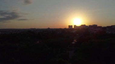 Aerial sunset timelapse footage of summer Kharkiv city center residential and park area in contrast sunlight