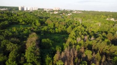 Cable car attraction aerial view from fpv drone in green summer Kharkiv city park, Sarzhyn Yar. Recreation area in city center