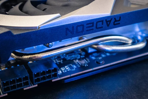 Kyiv, Ukraine - August 19, 2022: AMD Radeon RX6700XT chipset on MSI MECH 2X graphics card in blue light, PC hardware details close-up with selective focus