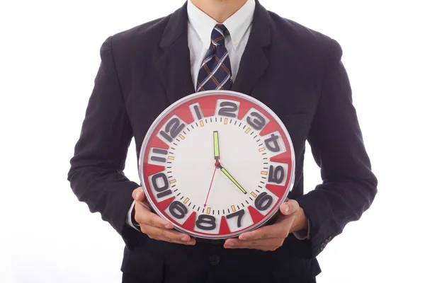 Businessman holding a clock in his hands — Stock Photo, Image