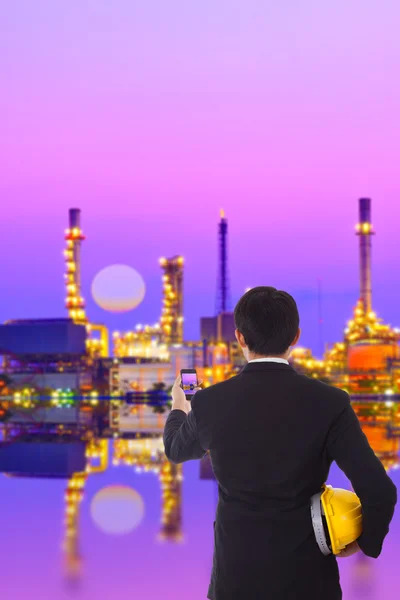 Construction engineer looks at the factory — Stock Photo, Image