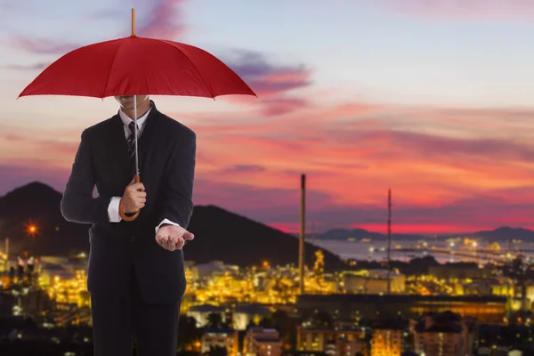 Businessman standing under umbrella. — Stock Photo, Image