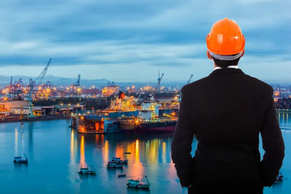 Businessman standing at its own port — Stock Photo, Image