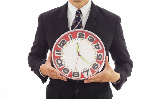 Businessman holding a clock — Stock Photo, Image