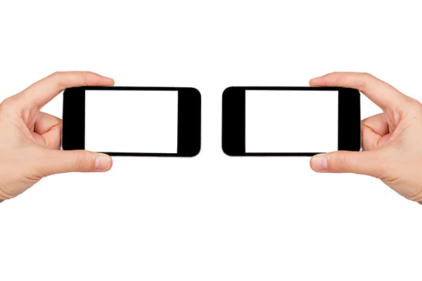 Dwie ręce trzymając dwa smartfony — Zdjęcie stockowe