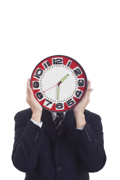 Businessman holding a clock — Stock Photo, Image