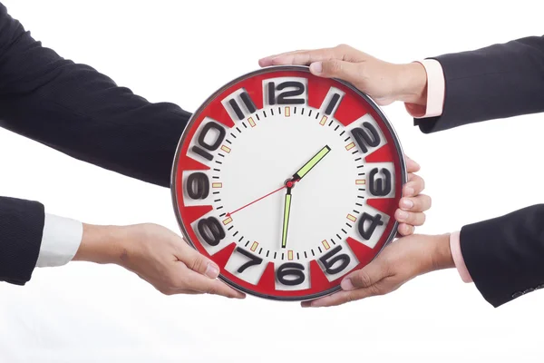 Two businessmen are holding clock — Stock Photo, Image