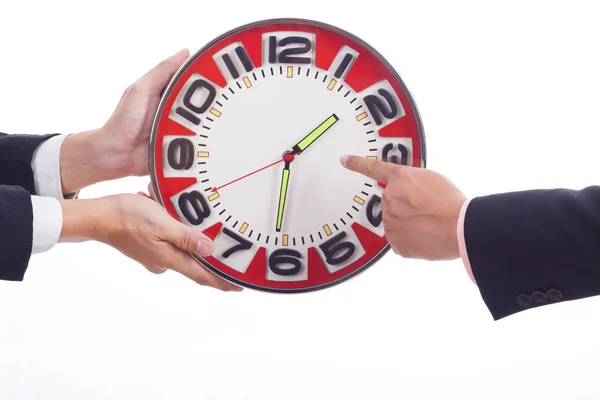 Zwei Geschäftsleute halten Uhr — Stockfoto