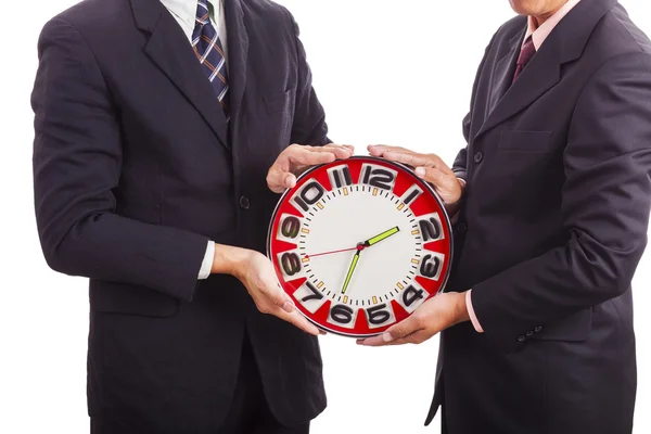 Twee zakenlieden houden klok — Stockfoto