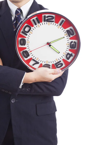 Zakenman die houdt een grote rode klok — Stockfoto