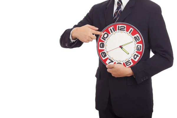 Empresário segurando um relógio — Fotografia de Stock