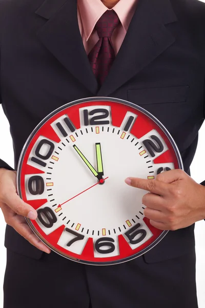 Businessman holding a clock — Stock Photo, Image