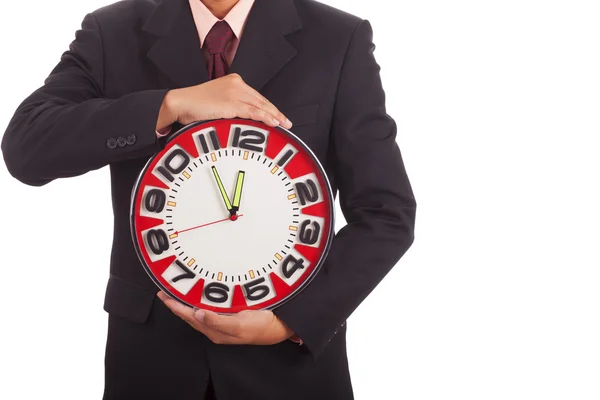 Businessman holding a clock — Stock Photo, Image