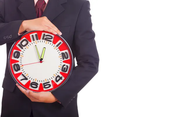 Businessman holding a clock — Stock Photo, Image