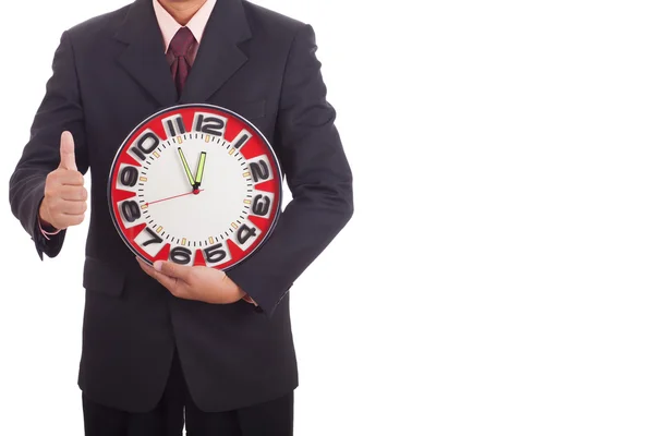 Affärsman som håller en klocka — Stockfoto