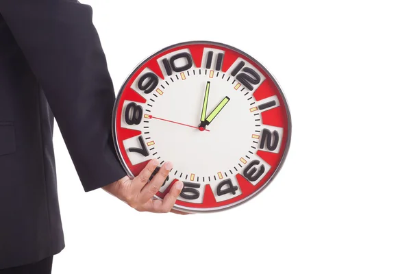 Businessman holding a clock — Stock Photo, Image